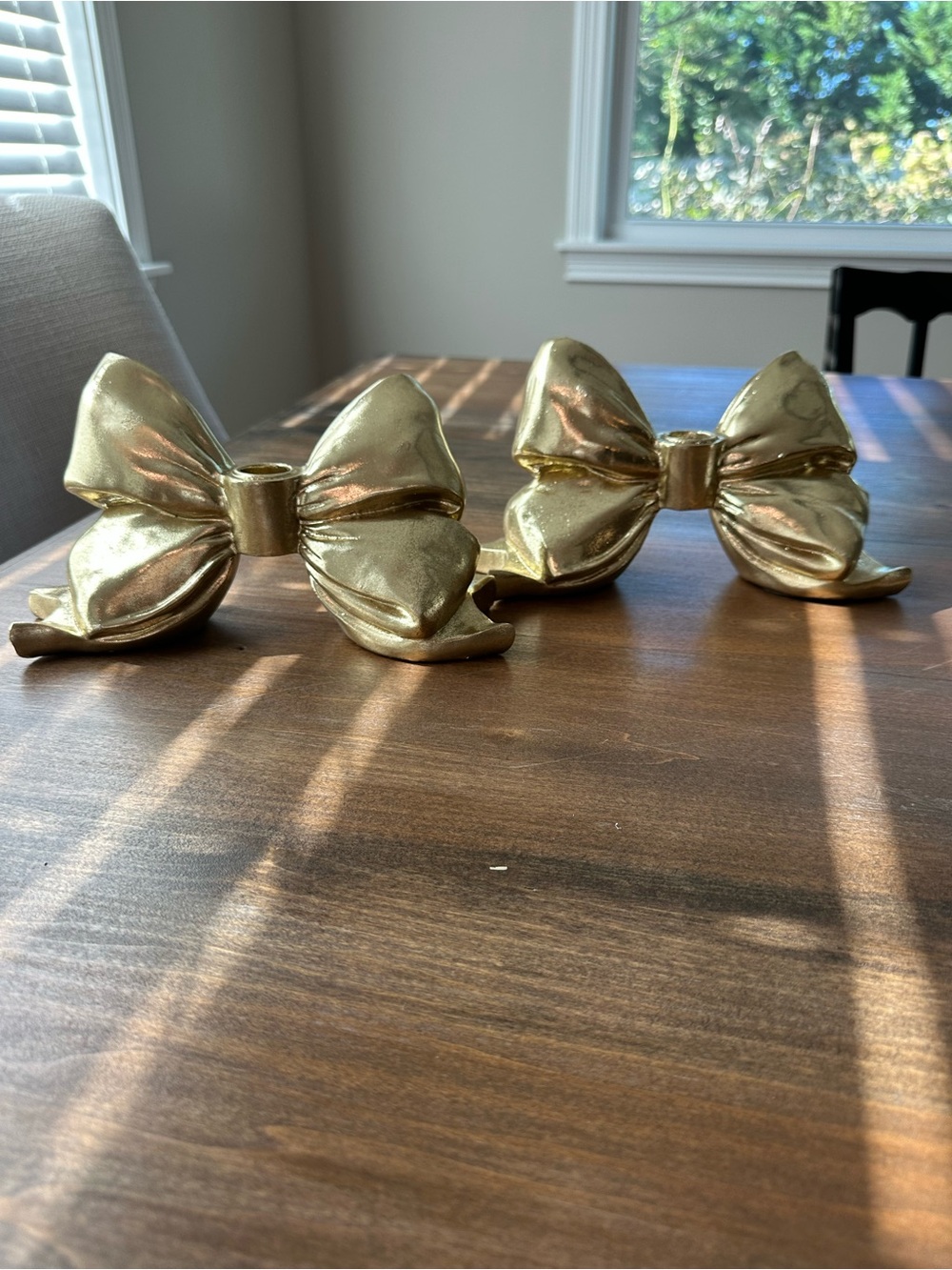 Twos Company gold bow candleholders